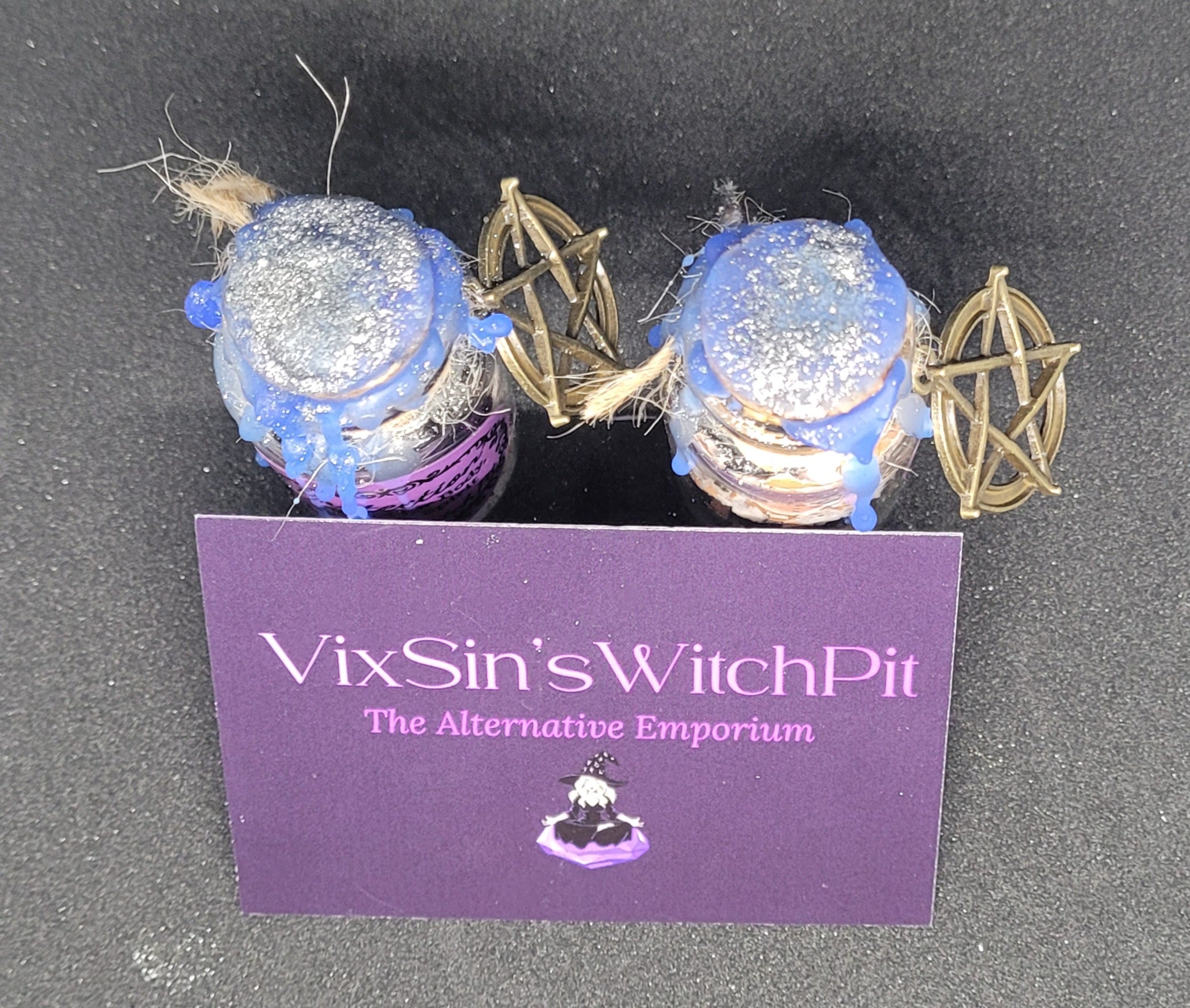Two Spell-Bottles from the top angle showing dark blue wax seal and pentagram charms. VixSin's WitchPit.
